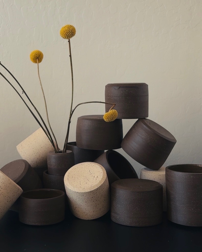 Myal ceramic cups arranged with yellow flowers